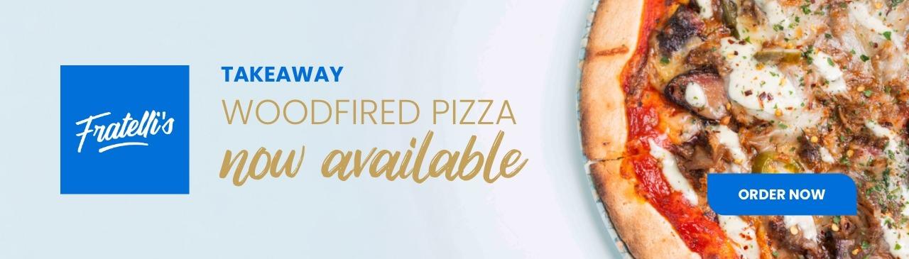 Close-up promotional image showing takeaway woodfired pizza with text indicating availability.