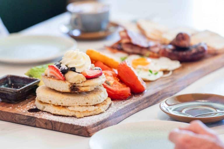 Breakfast dishes arranged on a wooden table