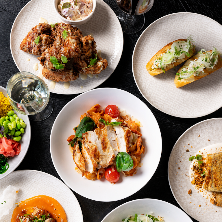 Shared dishes on a table at Fratelli's Bar & Dining