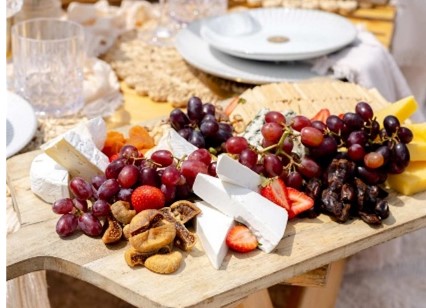 Grazing platter of cheeses, cured meats, fruit and crackers